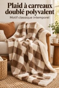 Plaid à motifs colorés drapé sur un canapé dans un salon chaleureux